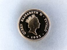A cased 1993 14ct gold Tuvalu 100 dollar coin, 7.