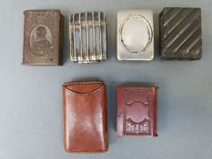 Six various vesta cases including an Edward VII example in the form of a book, plated examples,