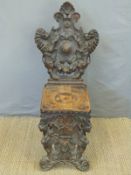 An oak hall chair carved with lions and mythical creatures,