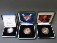 Two cased Royal Mint silver proof commemorative two pound coins,