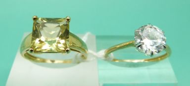 A 14ct gold ring set with cubic zirconia and a 9ct gold ring set with a citrine