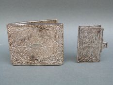 A white metal filigree book cover 5.5 x 3.