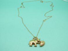 A 9ct gold chain and two 9ct gold charms in the form of an elephant and swan, weight 2.