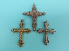 Three white metal filigree cross pendants,