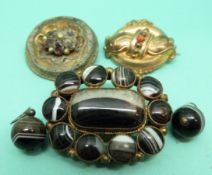 A Victorian brooch set with banded agate with similar earrings,