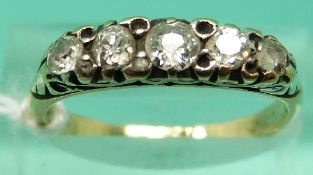 An 18ct gold ring set with five old cut diamonds (Size N)