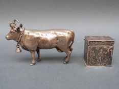 A white metal or similar novelty cow snuff or similar case with detachable head, length 9cm,