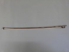 A Weichold violin bow with mother-of-pearl inlay