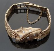 Brock & Co 14ct gold ladies wristwatch with diamond set cover in the form of a leaf,