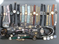 Over 50 various ladies and gentleman's wristwatches.