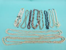 Ten pearl necklaces including single strands of freshwater pearls, a three strand pearl necklace,