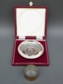 A cased feature hallmarked silver dish set with a Churchill crown,