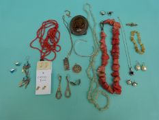 A silver St Christopher, silver ingot, silver rings, coral necklace, a pair of 9ct gold earrings,