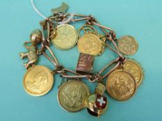 A 9ct gold charm bracelet mounted with three full sovereigns (1900, 1904 and 1964),