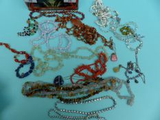 A coral necklace, lapis lazuli bracelet, tigers eye necklace, agate pendants and necklaces,