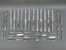 A set of 12 hallmarked silver handled dinner knives and further white metal handled cutlery