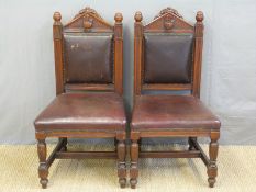 A pair of Oddfellows chairs with carved hand and heart