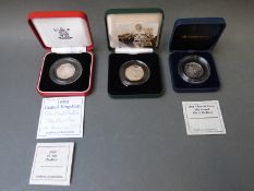 Three cased and certificated silver Piedfort 50 pence coins to include EU and Victoria Cross