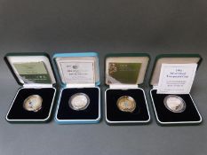 Four cased and certificated silver proof £2 coins to include United Nations etc