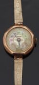 Medana 9ct gold ladies wristwatch with engraved opalescent face, on rolled gold bracelet,