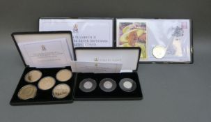 Three Jubilee Mint coin sets comprising silver £1 examples and gold plated examples