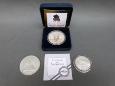 A cased Flying Scotsman £5 coin with certificate,