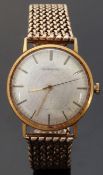 Garrard 9ct gold gentleman's wristwatch with gold hands and baton markers, on 9ct gold bracelet,