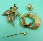 Two 9ct gold brooches one set with garnets and a 9ct gold earring, weight 13.