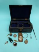 A hallmarked silver bangle, Victorian lockets, agate pendant,