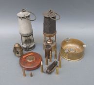 Two miners' lamps together with a collection of trench art,