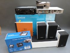 Linksys Kiss 1600 HD media player, together with Nikkai 3-5 portable digital TV, Sony speakers,