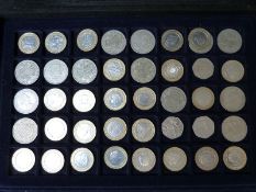 A metal collector's case containing twenty-six various collectable £2 coins,