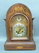 A mahogany cased mantel clock with domed top,