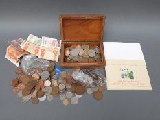 A collection of coins and bank notes,