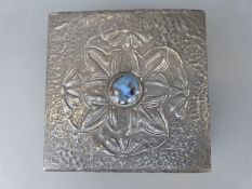 An Arts and Crafts pewter trinket box with applied likely Ruskin cabochon to lid,