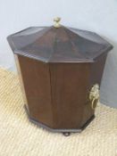 A Georgian mahogany octagonal wine cooler with shaped lift off lid and lions mask handles,