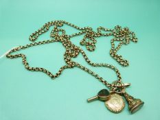 A yellow metal guard chain/ watch chain made up of faceted links and marked 9ct gold with a watch