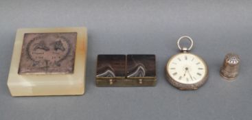A white metal pocket watch marked fine silver with engraved chased decoration, a small agate box,