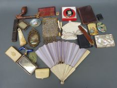 A quantity of collectables including mother-of-pearl purse, bone fan, jadeite pendant, pipe, purses,