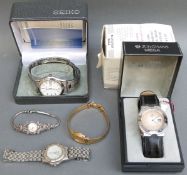 A cased Junghans mega radio controlled watch, silver and marcasite cocktail watch,