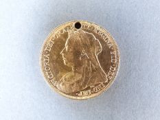 A 1901 gold full sovereign with small hole drilled for mount