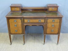 A late 19th/early 20thC leather inset desk with two drawers to top and galleried back,
