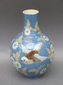 A CH Brannam pottery vase decorated with birds and flowers,