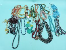 A large collection of beaded necklaces to include amethyst,