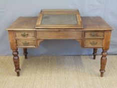 A 19thC mahogany clerk's desk having sloping lift up writing surface and four drawers,