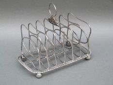 A Georgian hallmarked silver six slice toast rack London 1815, maker's mark rubbed, weight 237g,