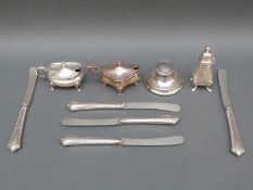 Two hallmarked silver mustards and a salt, weight 124g, a silver capstan inkwell,