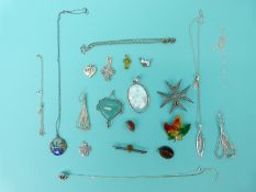 A collection of silver jewellery to include heart lockets, pendant set with pressed amber,