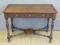 An oak hall table with turned legs united by bobbin turned,