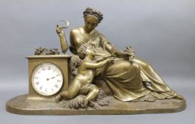 A late 19th century bronze figural mantel timepiece in the form of an Romanesque female figure with